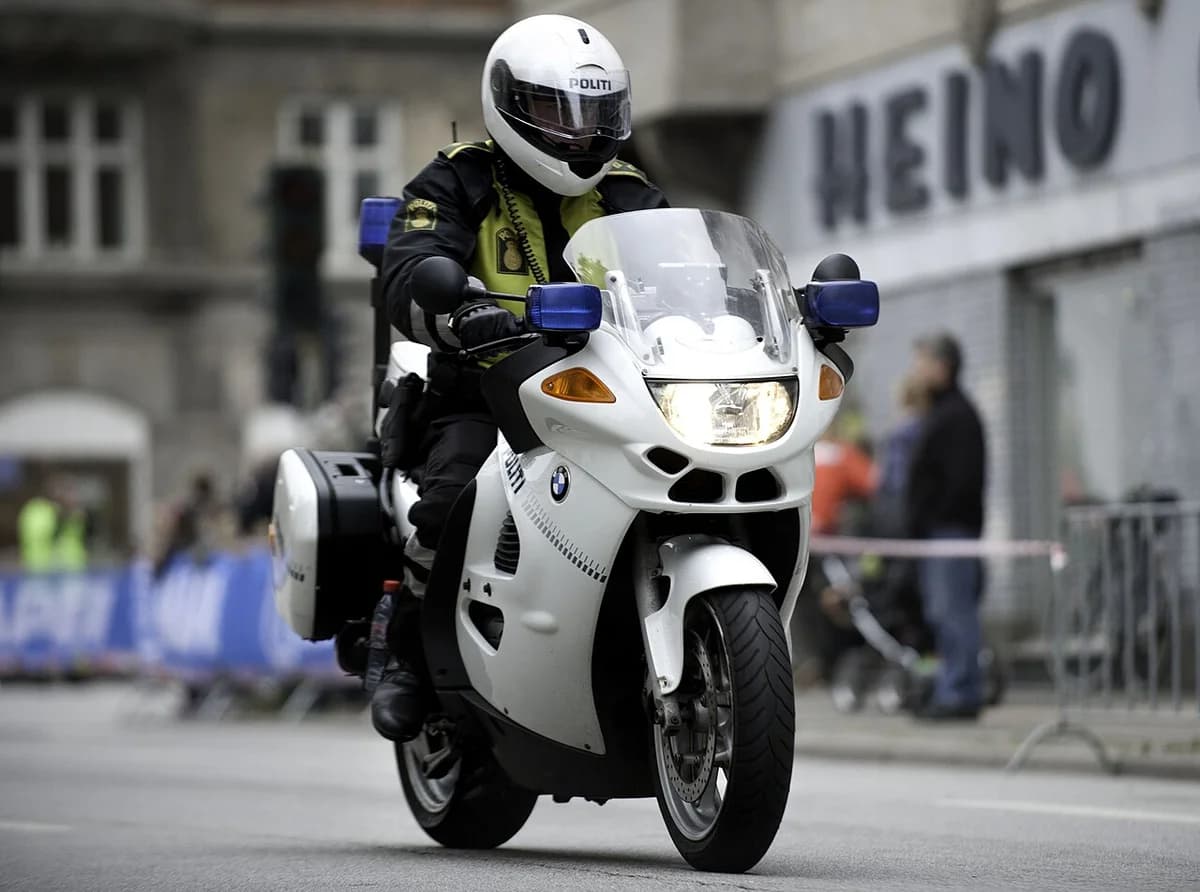 A Danish police officer rides a motorcycle during a road cycling event in Copenhagen.