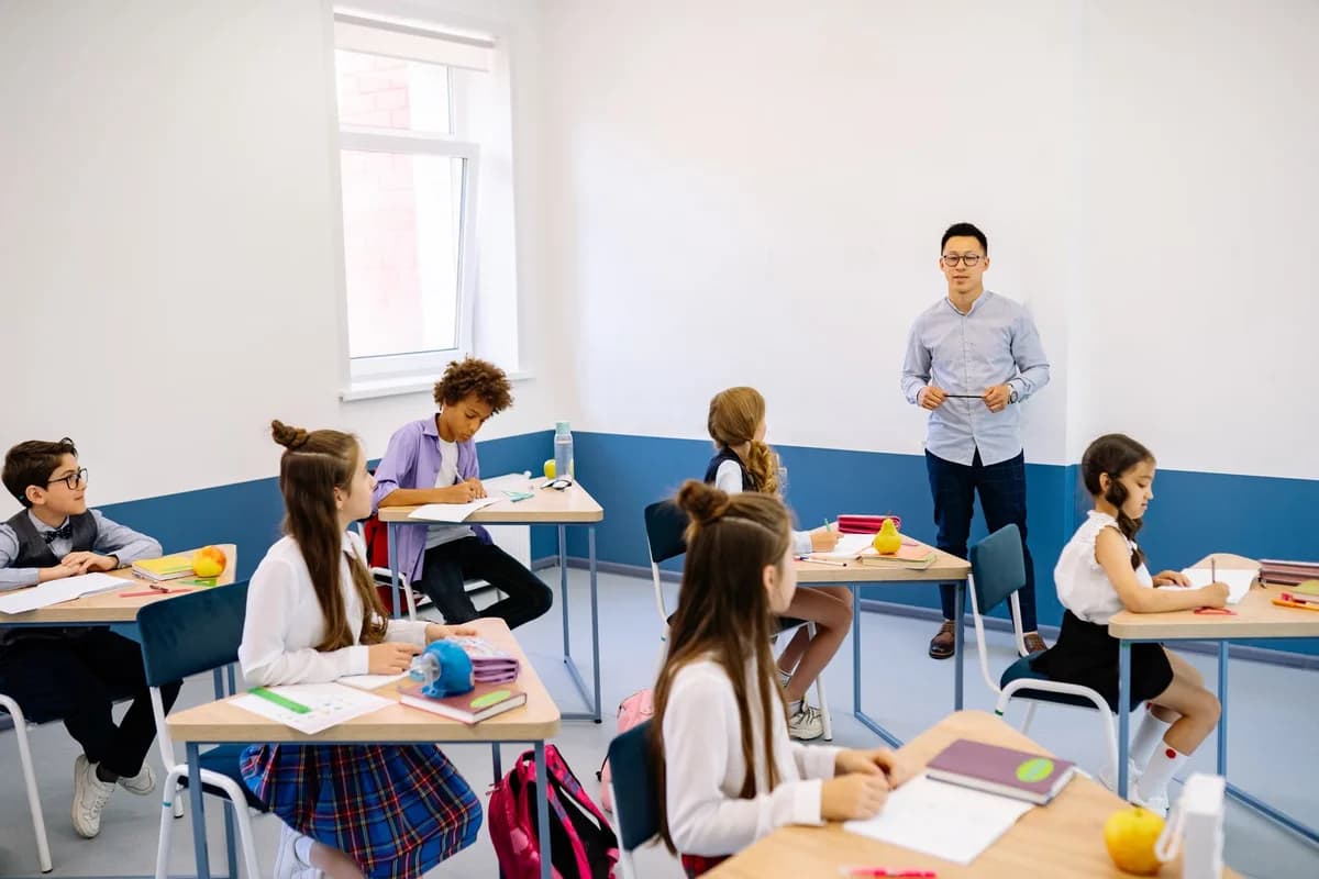 Teacher with a diverse group of schoolchildren in a modern classroom