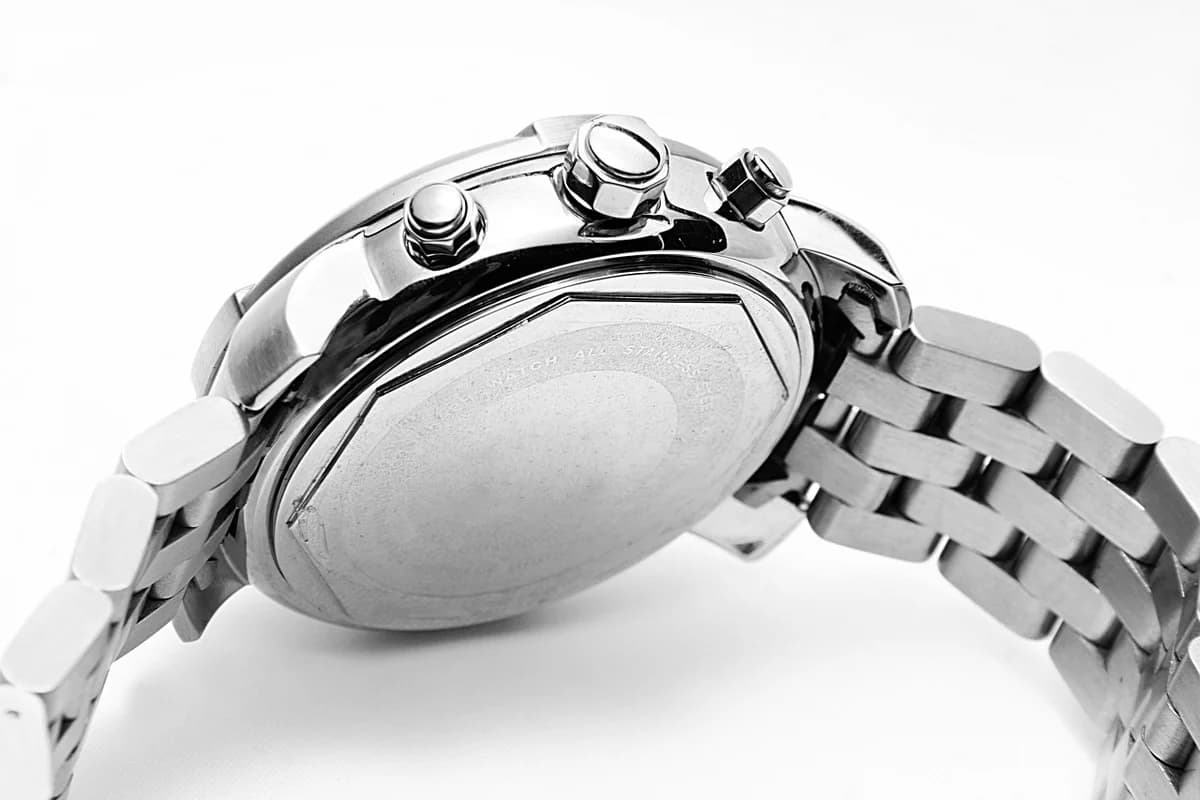 Close-up of a silver men's wristwatch with a metal bracelet