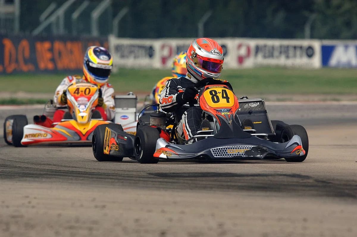Two go-karts racing on a track.